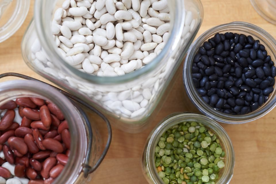 Glass jars with beans, lentils and peas